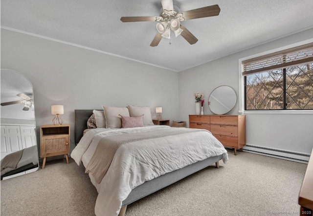 bedroom with a baseboard heating unit, light colored carpet, and a textured ceiling