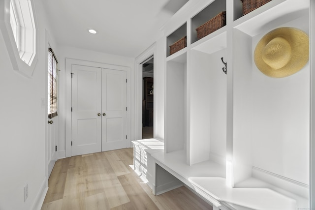 mudroom featuring light wood-type flooring and recessed lighting