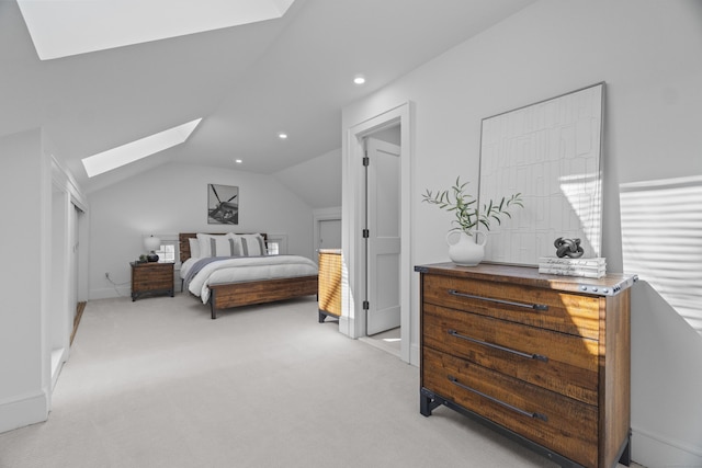 bedroom with lofted ceiling with skylight, recessed lighting, light colored carpet, and baseboards