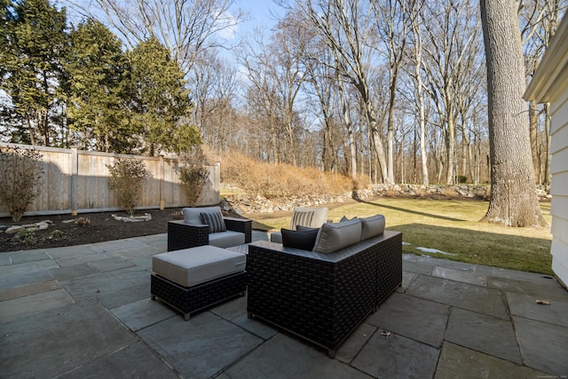 view of patio featuring fence and an outdoor hangout area