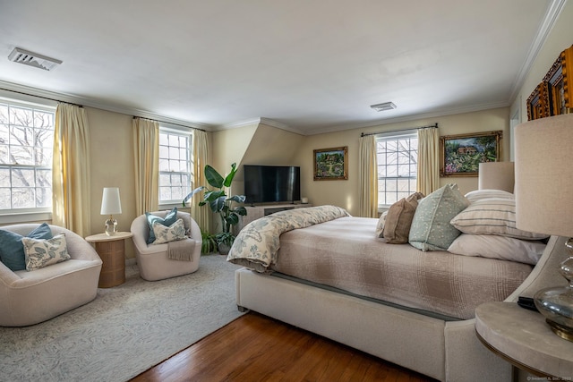 bedroom with ornamental molding, visible vents, dark wood-type flooring, and multiple windows