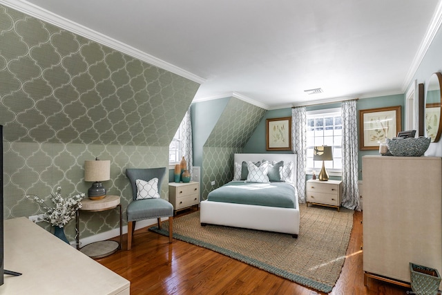 bedroom with wood-type flooring, visible vents, crown molding, and wallpapered walls