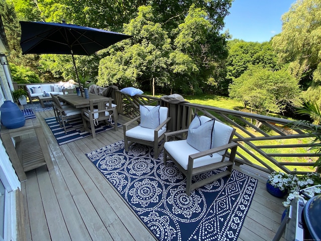 wooden terrace featuring an outdoor hangout area and outdoor dining space