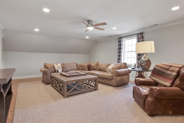 living room featuring ornamental molding, ceiling fan, light hardwood / wood-style floors, and vaulted ceiling