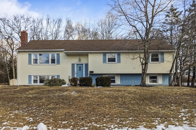 split foyer home with a yard