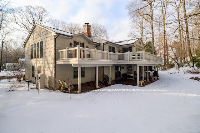 view of snow covered house