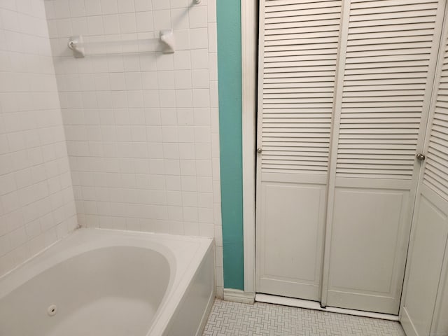 full bath with a closet and bathing tub / shower combination