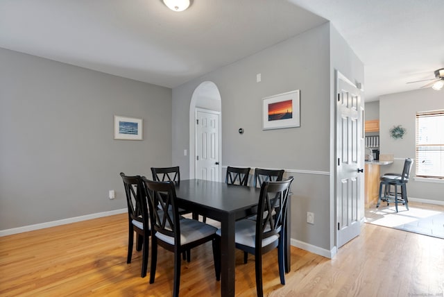 dining area featuring ceiling fan and light hardwood / wood-style flooring