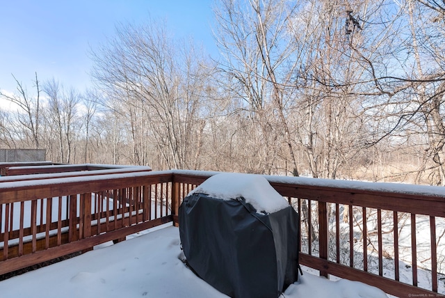 snow covered deck with grilling area