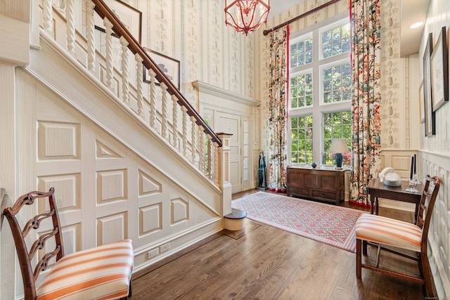4 Hemlock Rdg, Weston, CT 06883 - entrance foyer featuring a decorative wall, a high ceiling, stairway, wood finished floors, and wallpapered walls