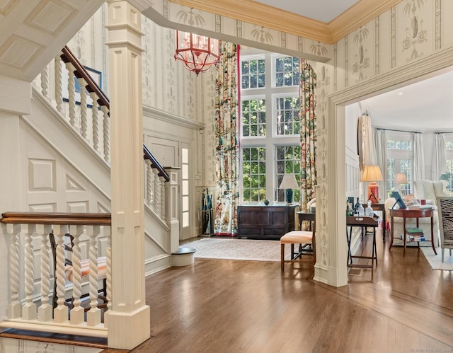 4 Hemlock Rdg, Weston, CT 06883 - entryway featuring a high ceiling, wallpapered walls, stairway, crown molding, and wood finished floors