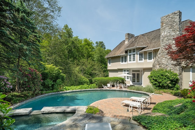 4 Hemlock Rdg, Weston, CT 06883 - view of pool with french doors, a patio, and a pool with connected hot tub