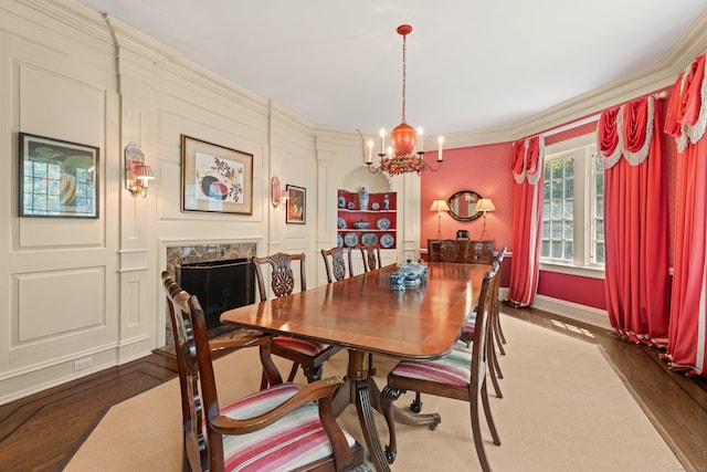 4 Hemlock Rdg, Weston, CT 06883 - dining room featuring a chandelier, crown molding, wood finished floors, a high end fireplace, and a decorative wall