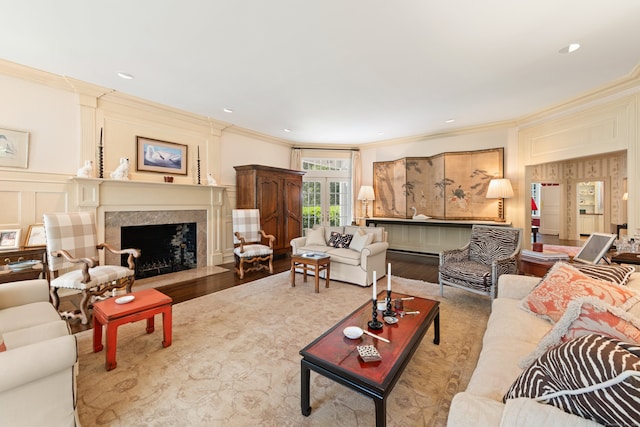4 Hemlock Rdg, Weston, CT 06883 - living area with ornamental molding, a decorative wall, wood finished floors, and a high end fireplace