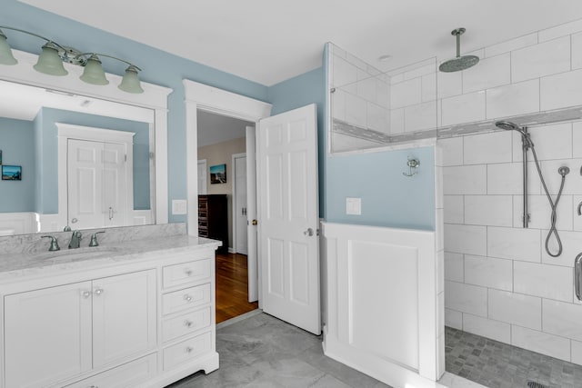 bathroom with a stall shower and vanity