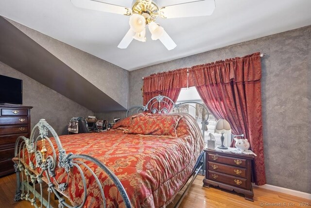 bedroom featuring ceiling fan and light wood-type flooring