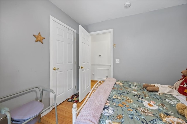 bedroom with wood finished floors