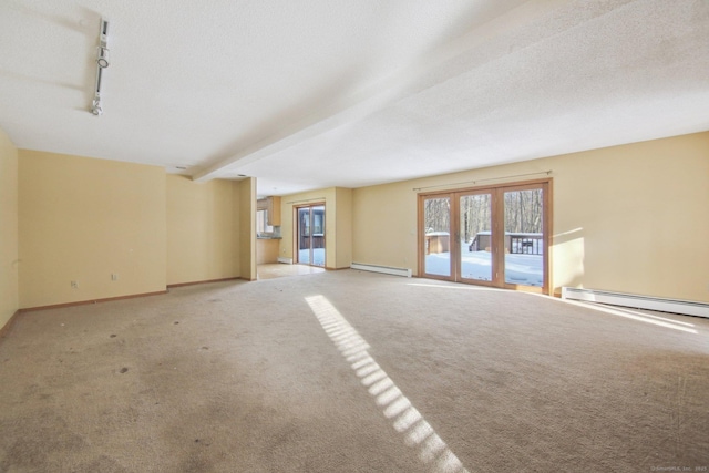 unfurnished living room featuring a textured ceiling, a baseboard radiator, baseboards, french doors, and carpet