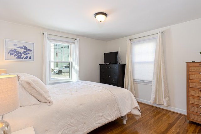 bedroom with wood-type flooring