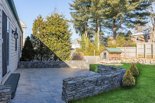 view of patio / terrace with a storage shed