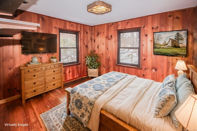 bedroom with wood-type flooring