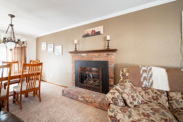 carpeted living area with a notable chandelier, a fireplace, baseboards, and ornamental molding