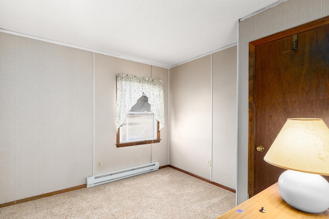 unfurnished room with carpet flooring and a baseboard radiator