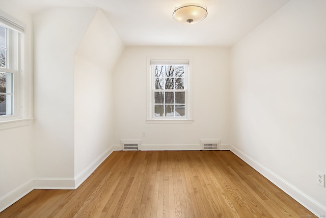 bonus room featuring light wood-type flooring