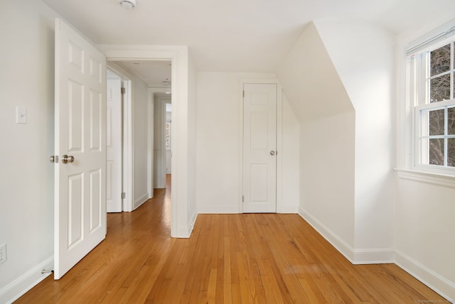 additional living space featuring light hardwood / wood-style floors