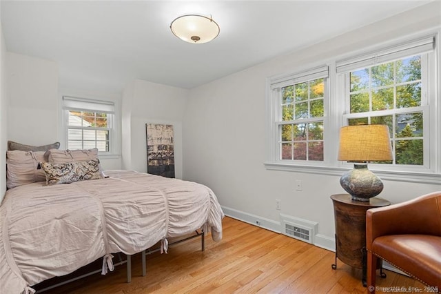 bedroom with light hardwood / wood-style flooring