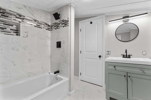 bathroom featuring vanity and tiled shower / bath