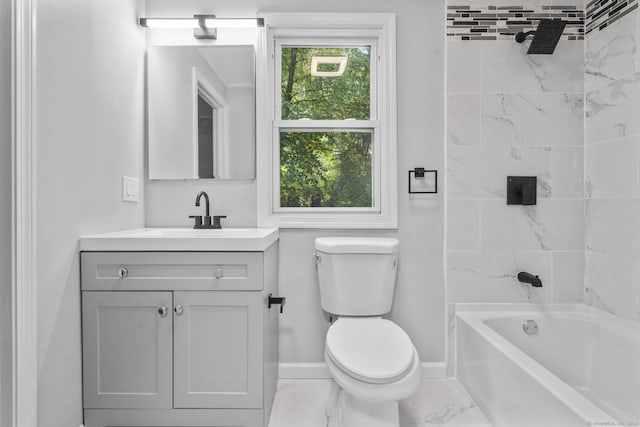 full bathroom with tiled shower / bath, vanity, toilet, and a wealth of natural light