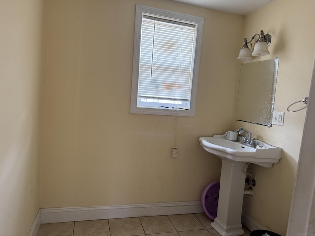 bathroom featuring tile patterned flooring and baseboards