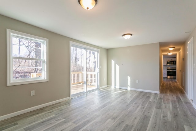 unfurnished room featuring light wood-type flooring