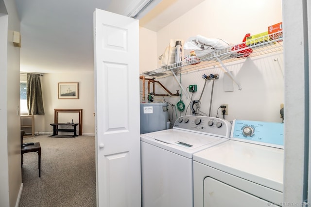 laundry room with water heater, washing machine and clothes dryer, and carpet