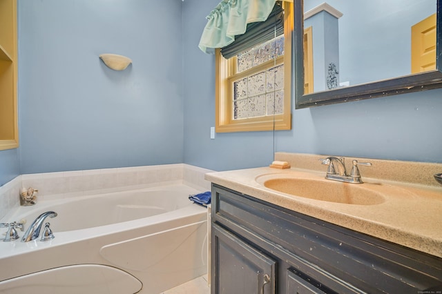 bathroom with vanity and a bathtub