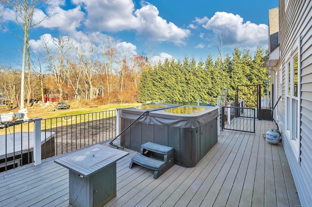 deck with a hot tub