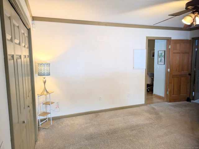 unfurnished room with light carpet and ceiling fan