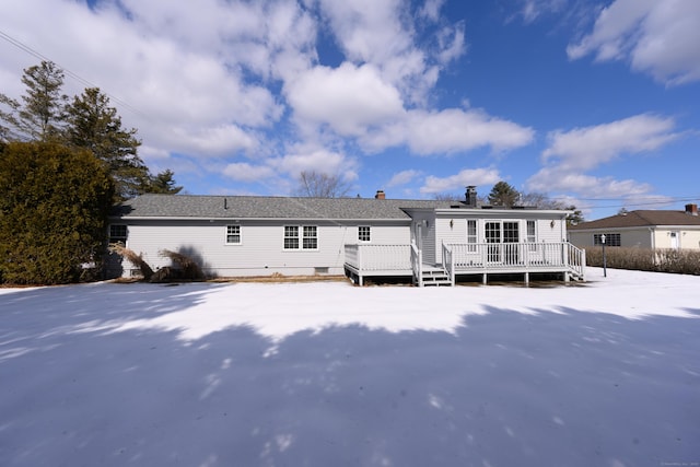 rear view of property with a deck