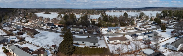 snowy aerial view featuring a residential view