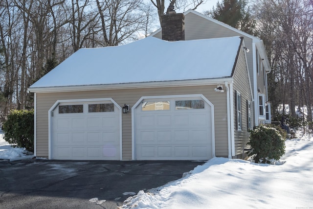 view of snow covered garage