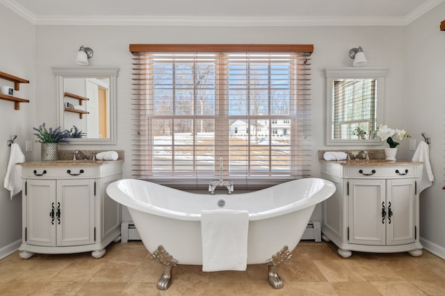 bathroom with ornamental molding, a soaking tub, and vanity