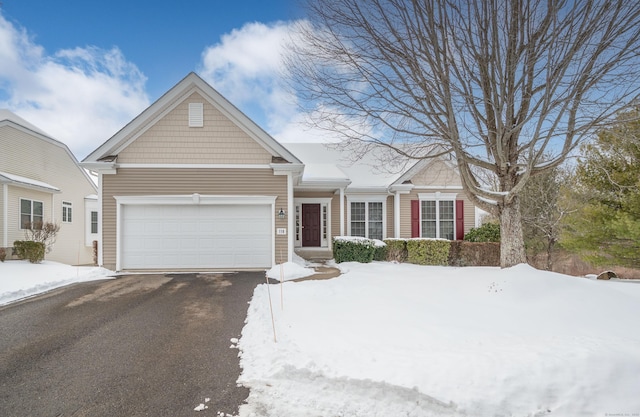 view of front of home with an attached garage and driveway