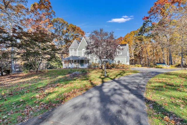 view of front of property with a front lawn and a porch