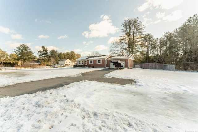 view of front of property featuring fence