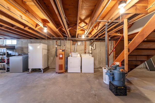 basement with washer and dryer and electric water heater