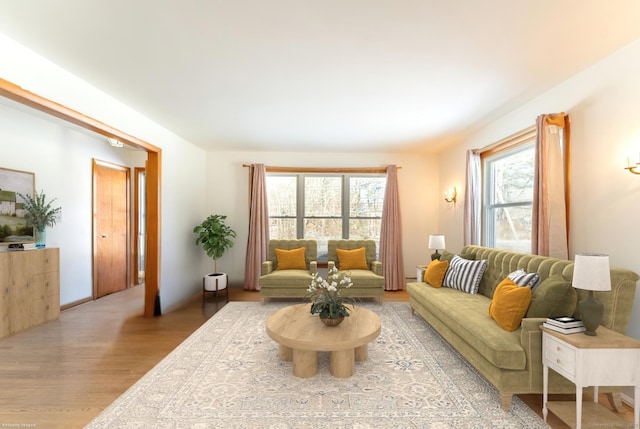 living area featuring plenty of natural light and light wood-style floors