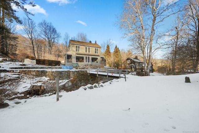 view of snow covered house