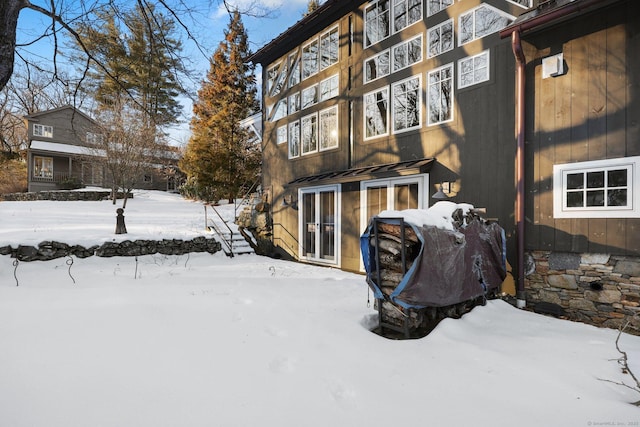 view of snow covered house