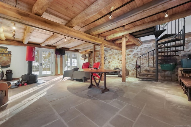 interior space with french doors, beam ceiling, wood ceiling, and track lighting